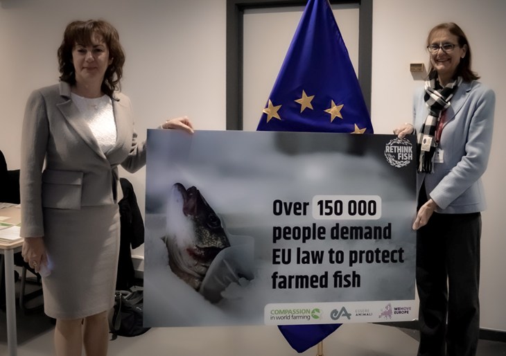 Olga holding petition banner
