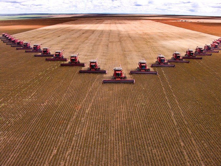 Large tractors in a row on field